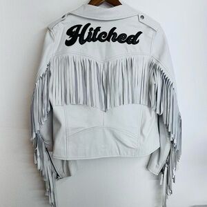 “Hitched” white leather fringe jacket